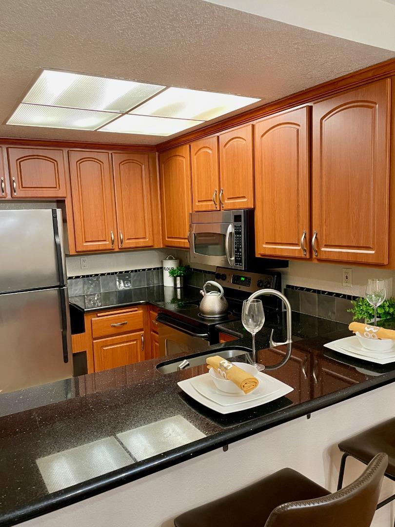 862 La Barbera Drive San Jose, CA 95126 - Photo 3 of 29 a kitchen with sink a window and cabinets