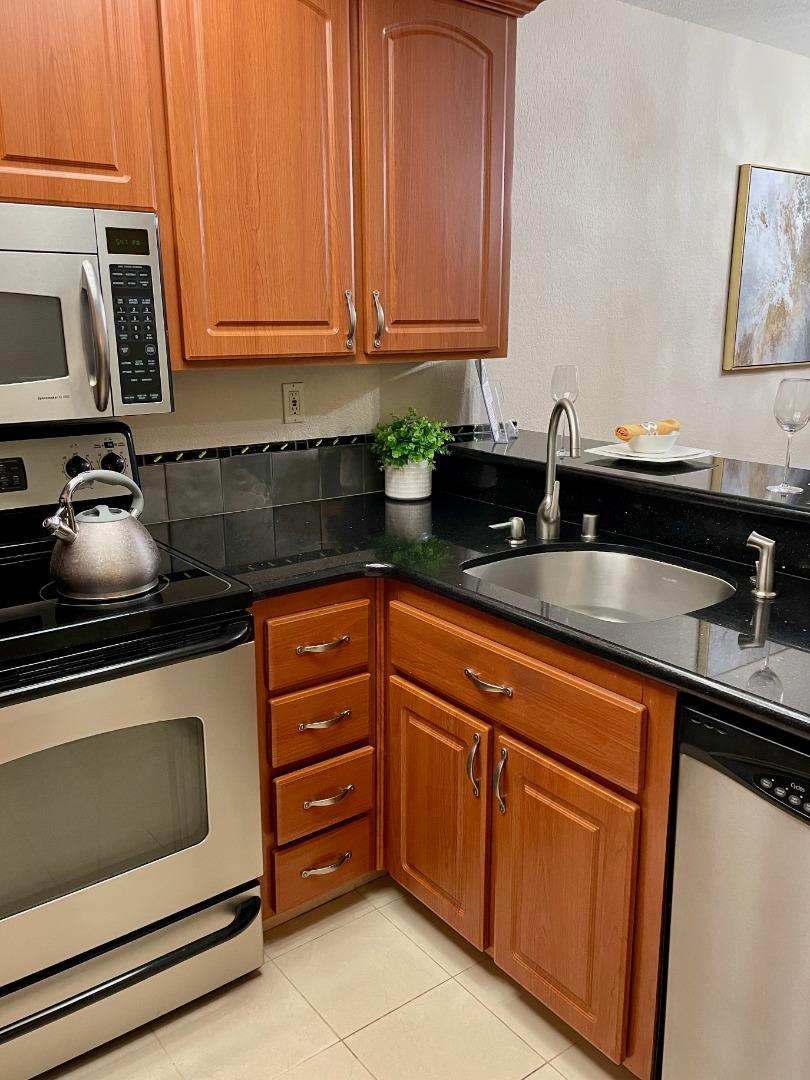 862 La Barbera Drive San Jose, CA 95126 - Photo 5 of 29 a kitchen with granite countertop a sink and cabinets