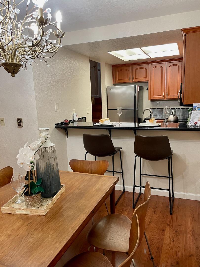 862 La Barbera Drive San Jose, CA 95126 - Photo 7 of 29 a kitchen with a table chairs stove and cabinets