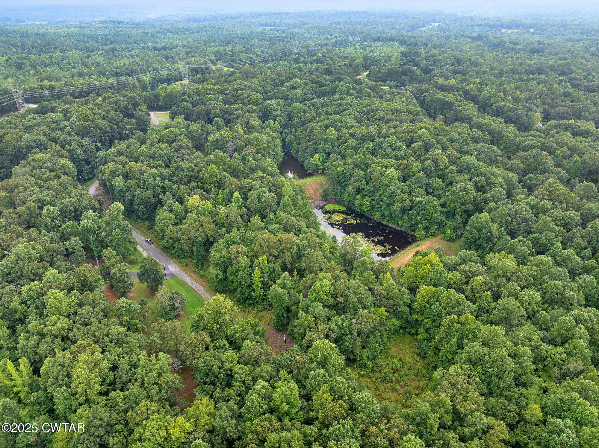 213 Jason Hollow Road Cedar Grove, TN 38321 - Photo 2 of 18 an aerial view of residential houses with outdoor space and trees