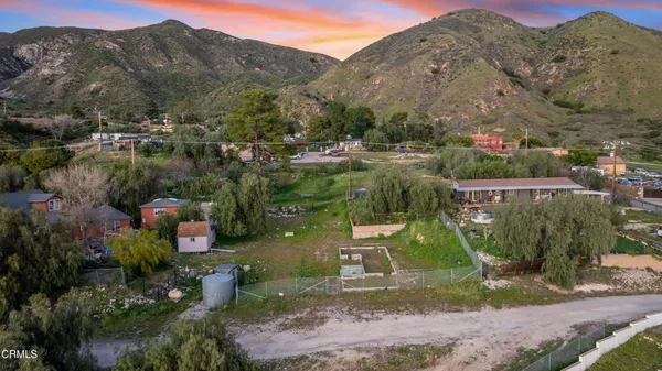 a view of a town with mountains in the background