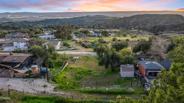 an aerial view of residential house and outdoor space