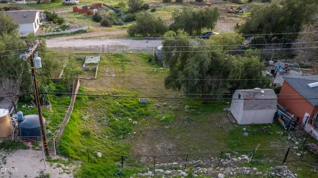 an aerial view of a house with a garden