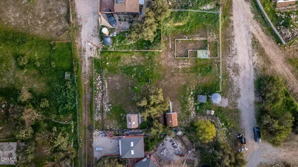 an aerial view of houses with yard