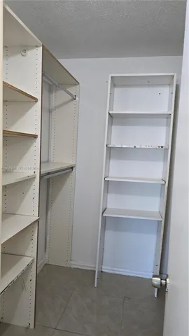 a view of an empty walk in closet