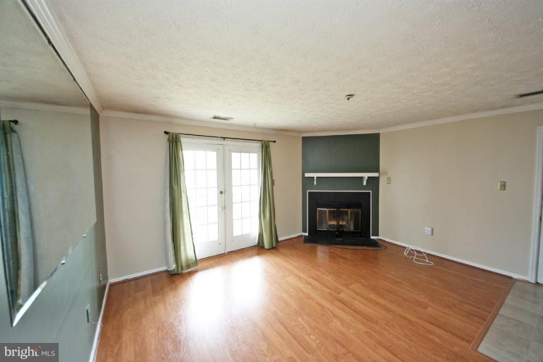 6410 Greenfield Road, Unit 1003 Elkridge, MD 21075 - Photo 4 of 23 Living Room with Sliders to Balcony