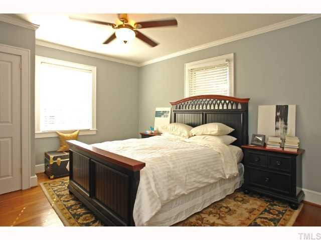 215 Glascock Street Raleigh, NC 27604 - Photo 8 of 12 The master bedroom has 2 closets, upgraded ceiling fan, crown molding & hardwoods. Master Bedroom