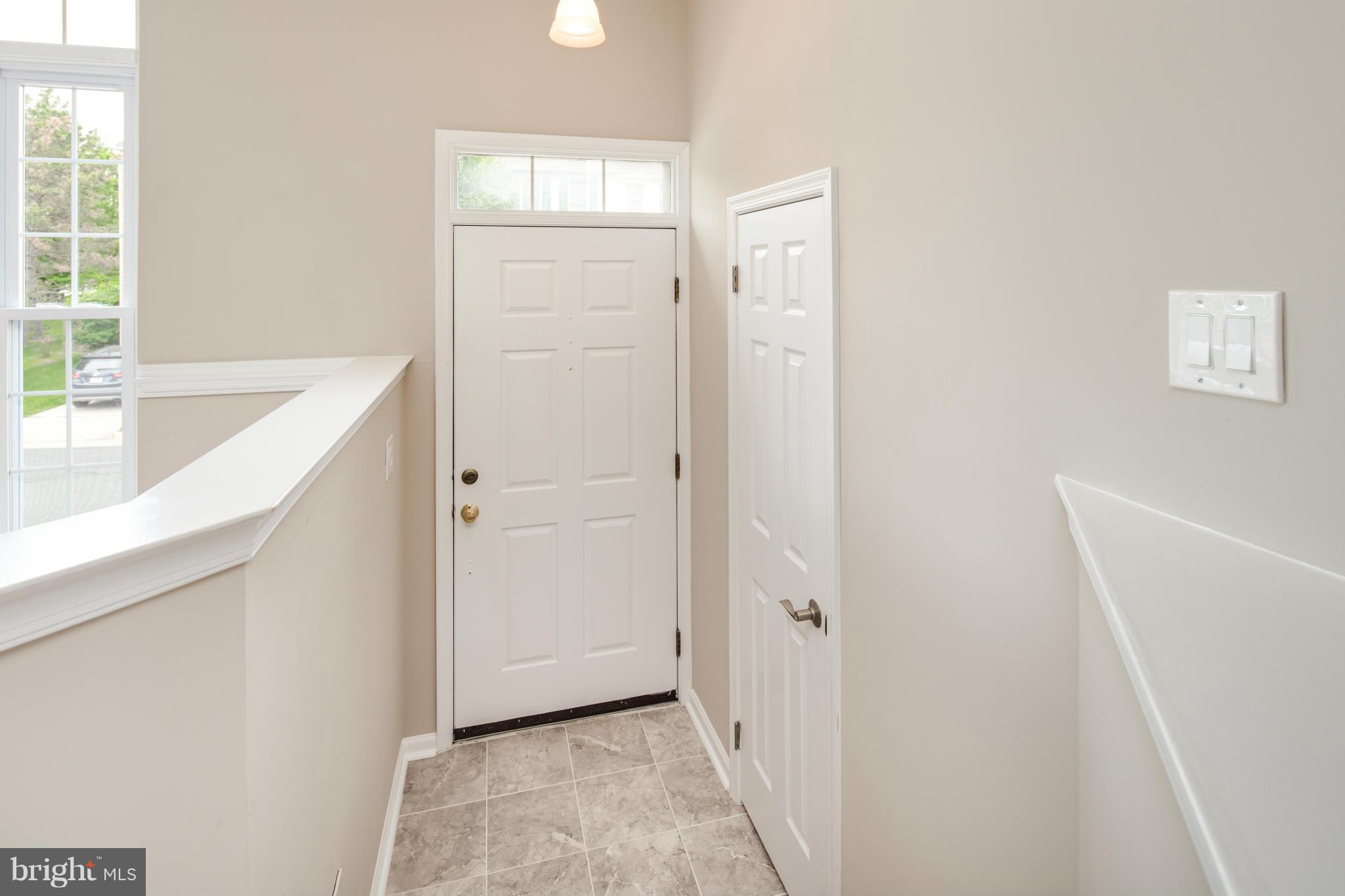 46871 Rabbitrun Terrace Sterling, VA 20164 - Photo 2 of 30 a view of a kitchen from the hallway
