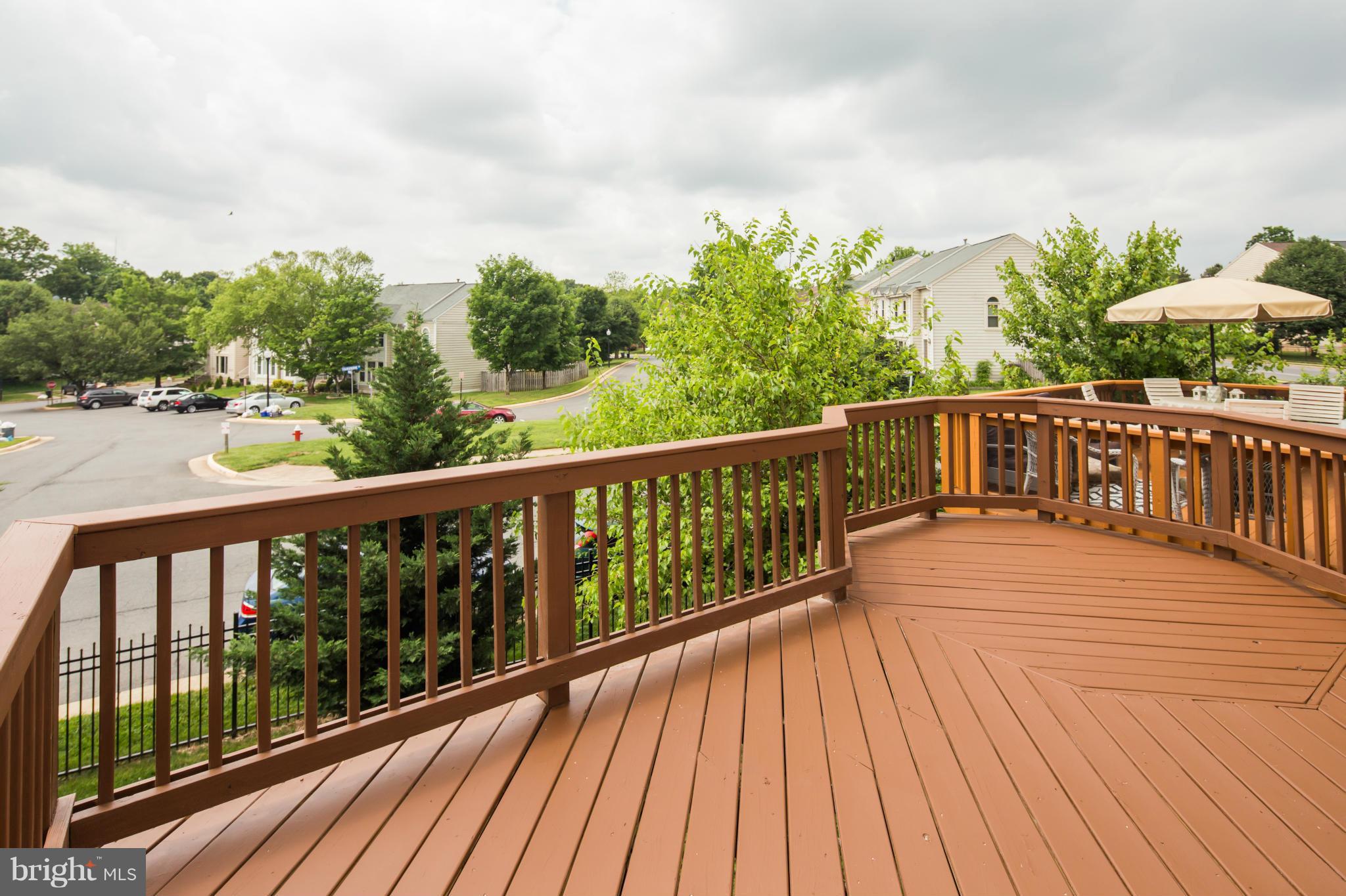 46871 Rabbitrun Terrace Sterling, VA 20164 - Photo 11 of 30 a view of balcony with wooden floor and fence