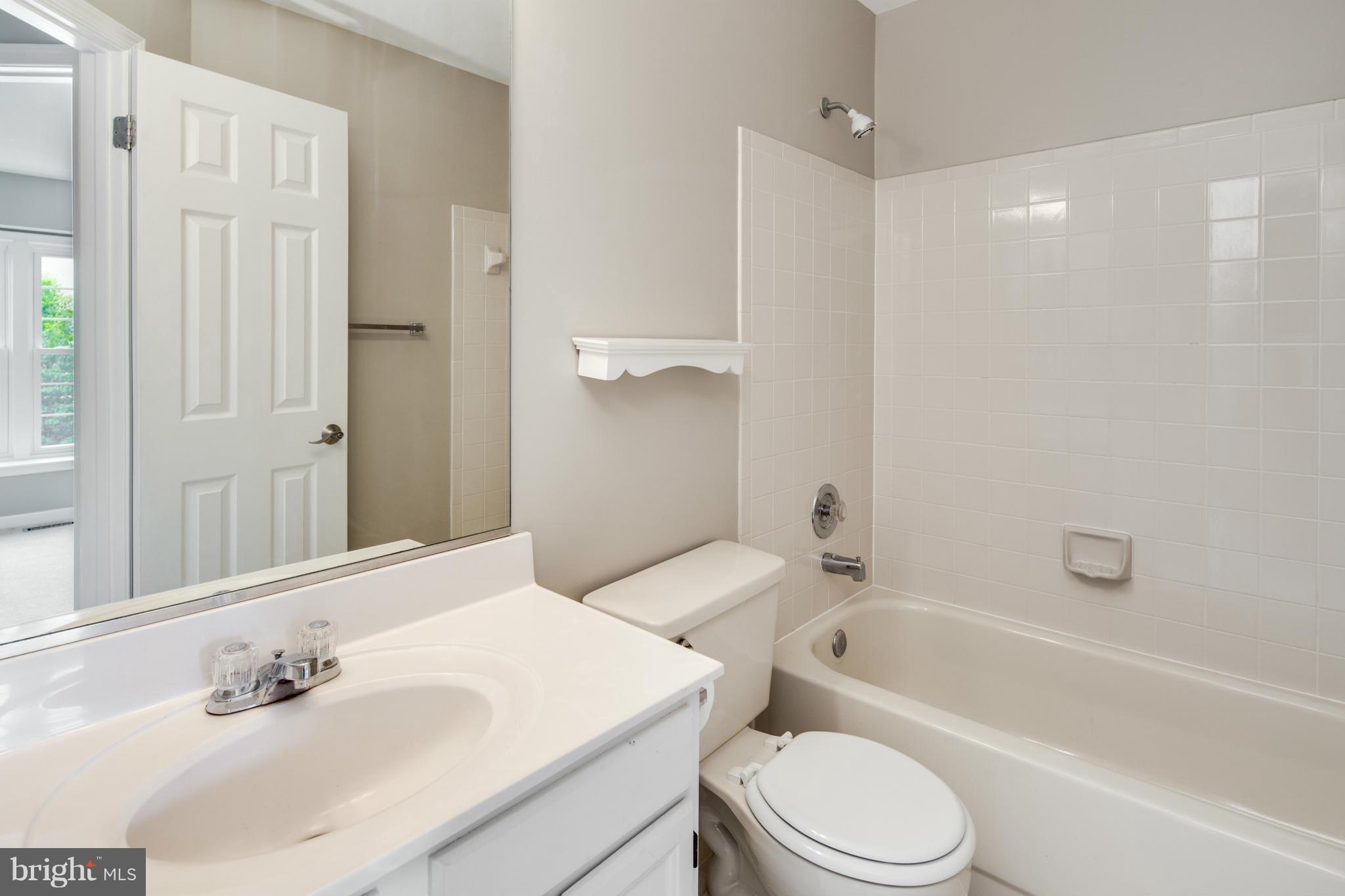 46871 Rabbitrun Terrace Sterling, VA 20164 - Photo 21 of 30 a bathroom with a sink toilet and shower