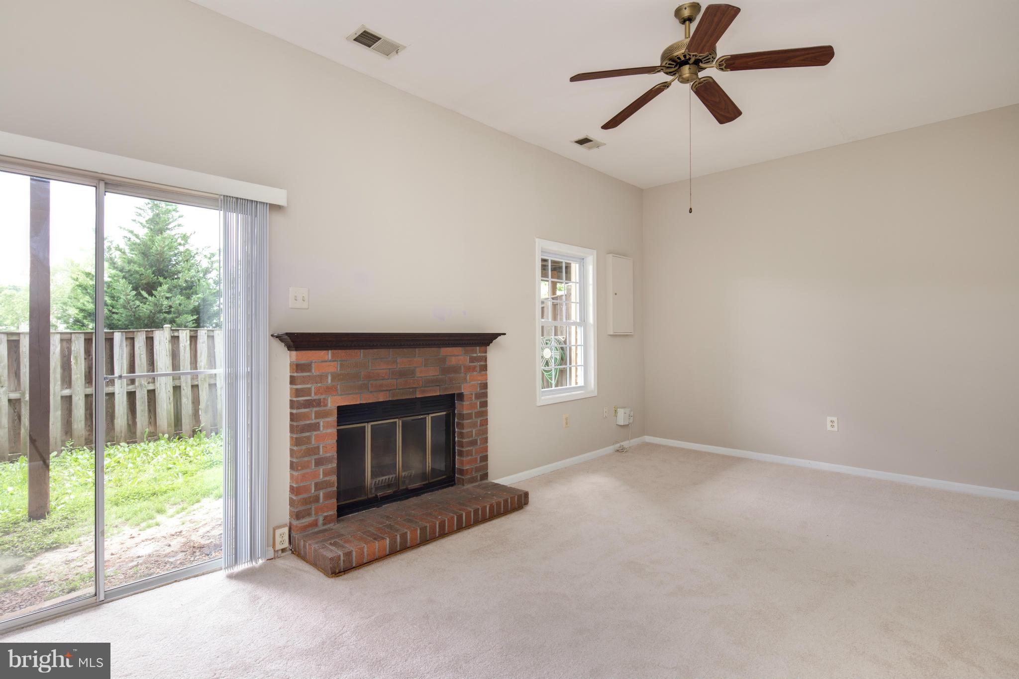 46871 Rabbitrun Terrace Sterling, VA 20164 - Photo 23 of 30 a living room with furniture and a fireplace