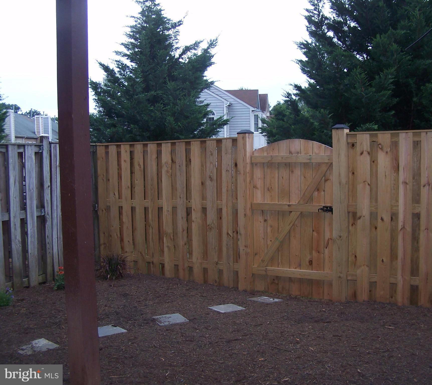 46871 Rabbitrun Terrace Sterling, VA 20164 - Photo 27 of 30 a view of a backyard with wooden fence