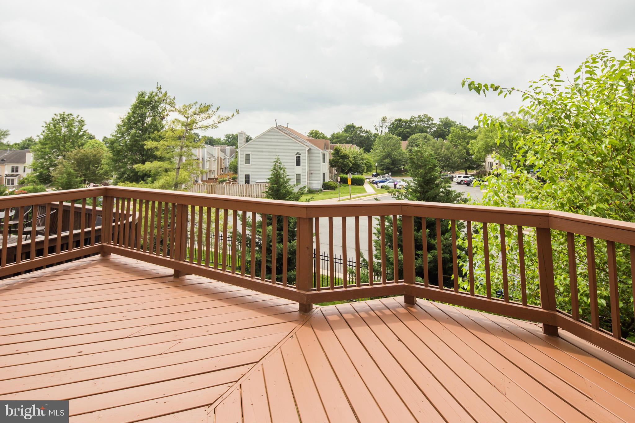 46871 Rabbitrun Terrace Sterling, VA 20164 - Photo 10 of 30 a view of balcony with wooden floor and fence