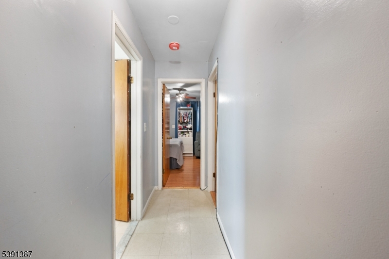 566 2nd Avenue Elizabeth, NJ 07202 - Photo 11 of 38 a view of a hallway with wooden shelves