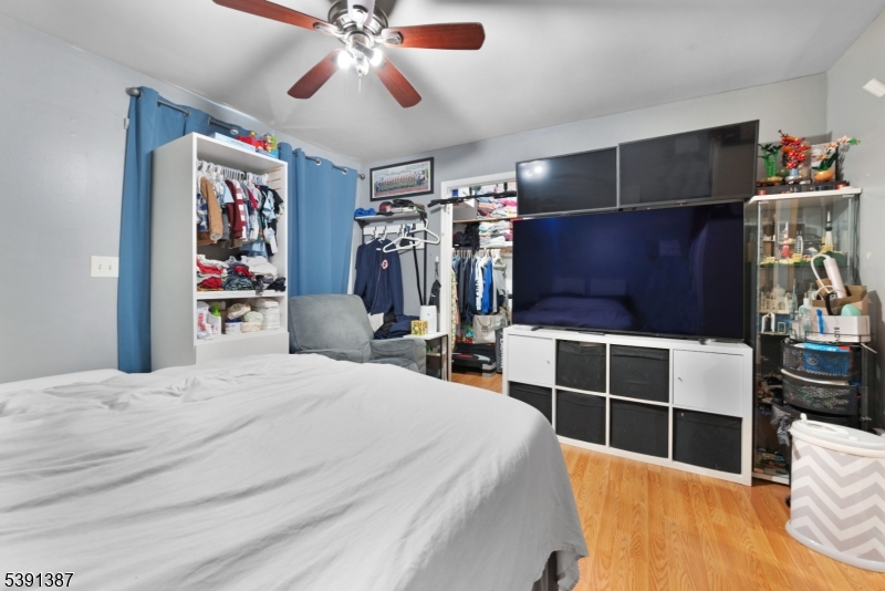 566 2nd Avenue Elizabeth, NJ 07202 - Photo 15 of 38 a bedroom with bed and walk in closet