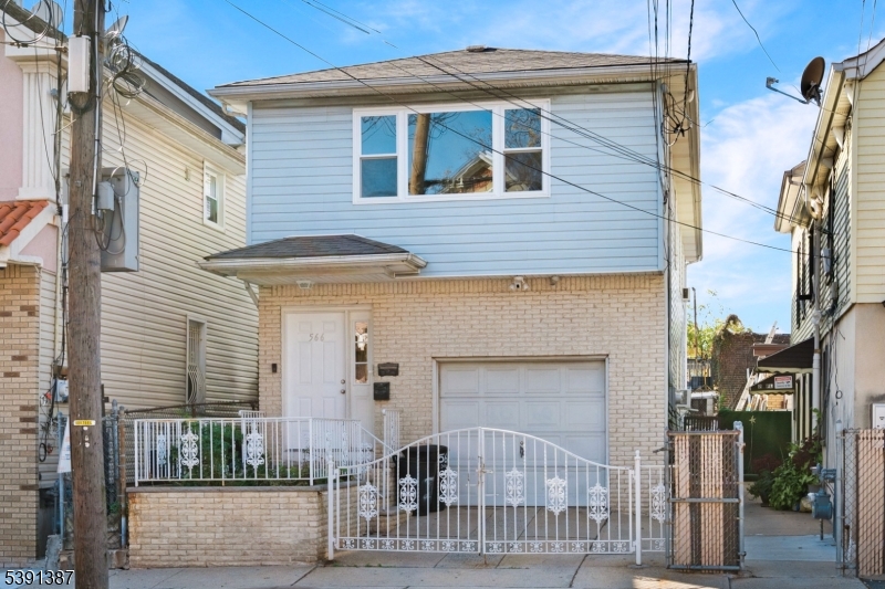 566 2nd Avenue Elizabeth, NJ 07202 - Photo 2 of 38 a front view of a house with a porch