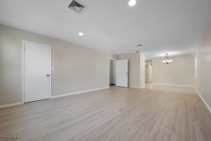 566 2nd Avenue Elizabeth, NJ 07202 - Photo 21 of 38 a view of an empty room with wooden floor