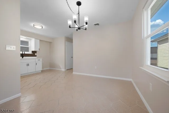 a view of a kitchen with electric appliances
