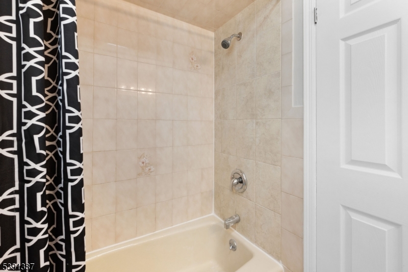 566 2nd Avenue Elizabeth, NJ 07202 - Photo 30 of 38 a bathroom with a bathtub and shower