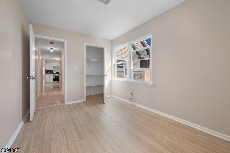 566 2nd Avenue Elizabeth, NJ 07202 - Photo 35 of 38 wooden floor in an empty room