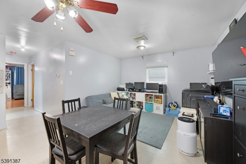 566 2nd Avenue Elizabeth, NJ 07202 - Photo 10 of 38 a view of a dining room with furniture and a kitchen