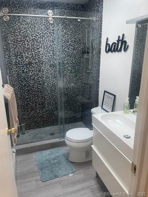 11 Shawnee Road Trumbull, CT 06611 - Photo 10 of 14 a bathroom with a toilet and a shower