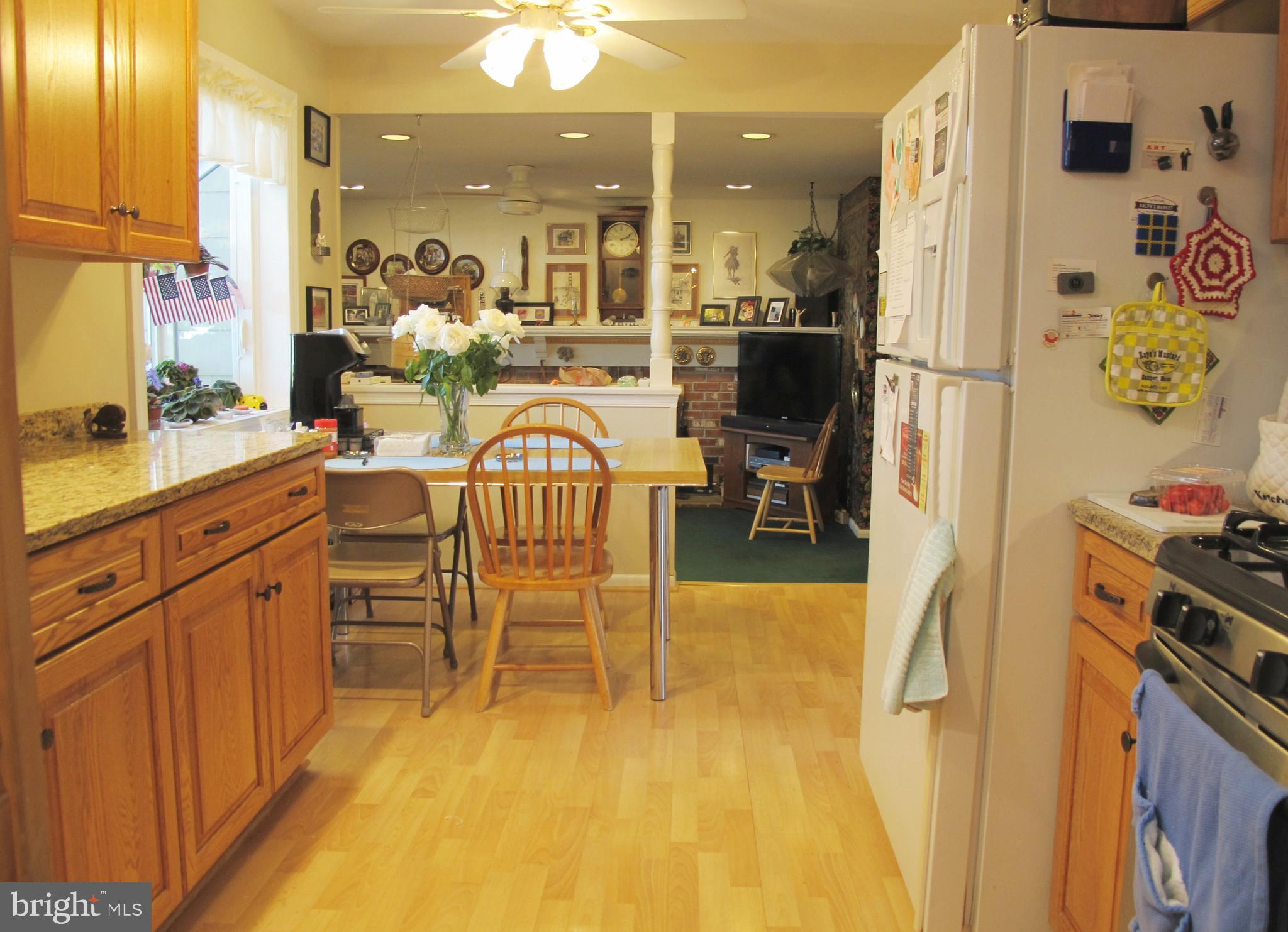 164 Oxford Road Delran, NJ 08075 - Photo 11 of 38 a dining room with a table chairs and a kitchen view