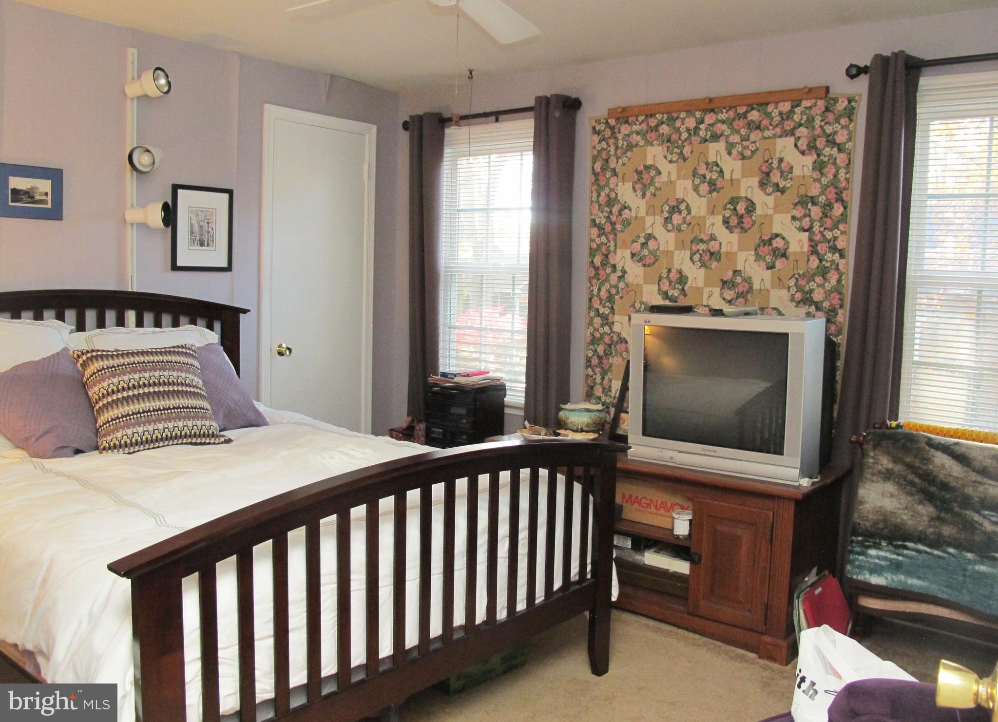 164 Oxford Road Delran, NJ 08075 - Photo 28 of 38 a bedroom with a bed and a fireplace