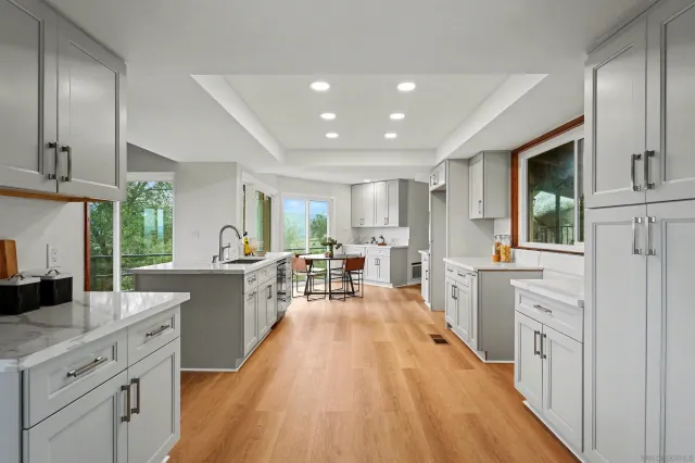 a kitchen with sink a counter top space and appliances