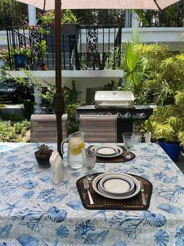 a dining room with furniture and a wooden floor