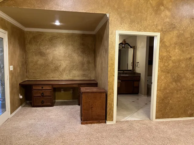 a view of room with a flat tv screen and a dresser