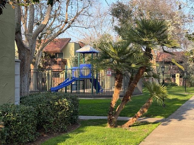 2881 Huntington Boulevard, Unit 150 Fresno, CA 93721 - Photo 12 of 15 a front view of a house with a yard