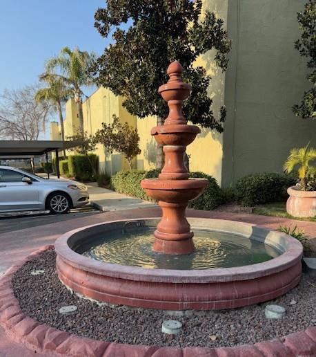 2881 Huntington Boulevard, Unit 150 Fresno, CA 93721 - Photo 13 of 15 a view of fountain in the corner of a house