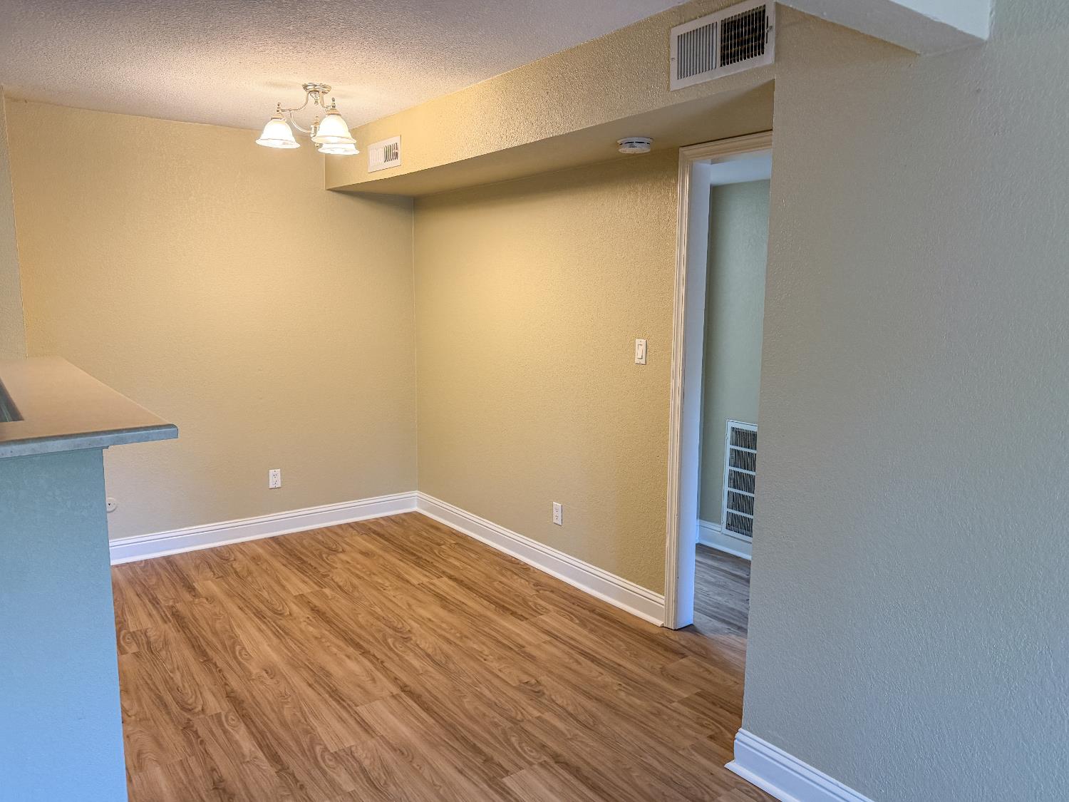 2881 Huntington Boulevard, Unit 150 Fresno, CA 93721 - Photo 5 of 15 a view of a room with wooden floor