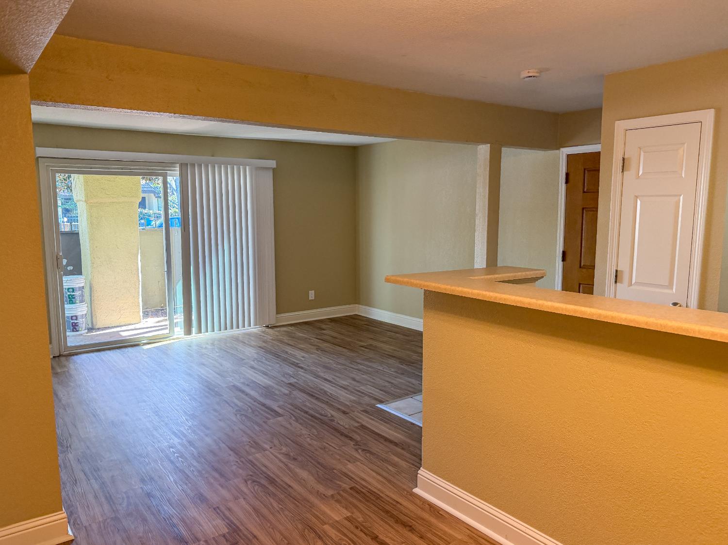 2881 Huntington Boulevard, Unit 150 Fresno, CA 93721 - Photo 6 of 15 a view of a room with wooden floor and a window