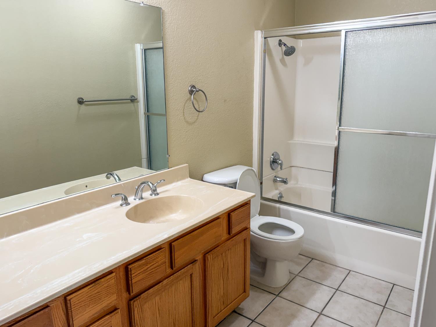 2881 Huntington Boulevard, Unit 150 Fresno, CA 93721 - Photo 8 of 15 a bathroom with a sink toilet and shower