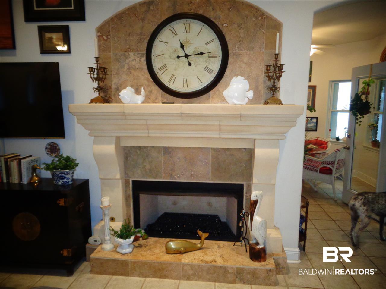 9110 Bay Point Drive Elberta, AL 36530 - Photo 9 of 50 Travertine tiled hearth with mantle. Natural Gas.