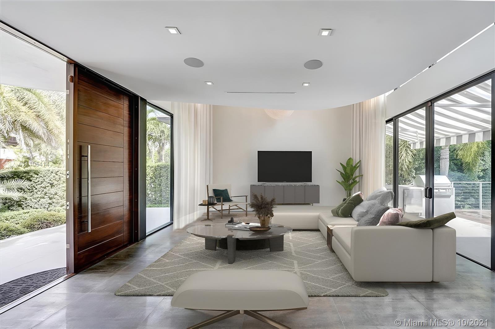 2125 North Bay Road Miami Beach, FL 33140 - Photo 11 of 71 a living room with furniture and large windows
