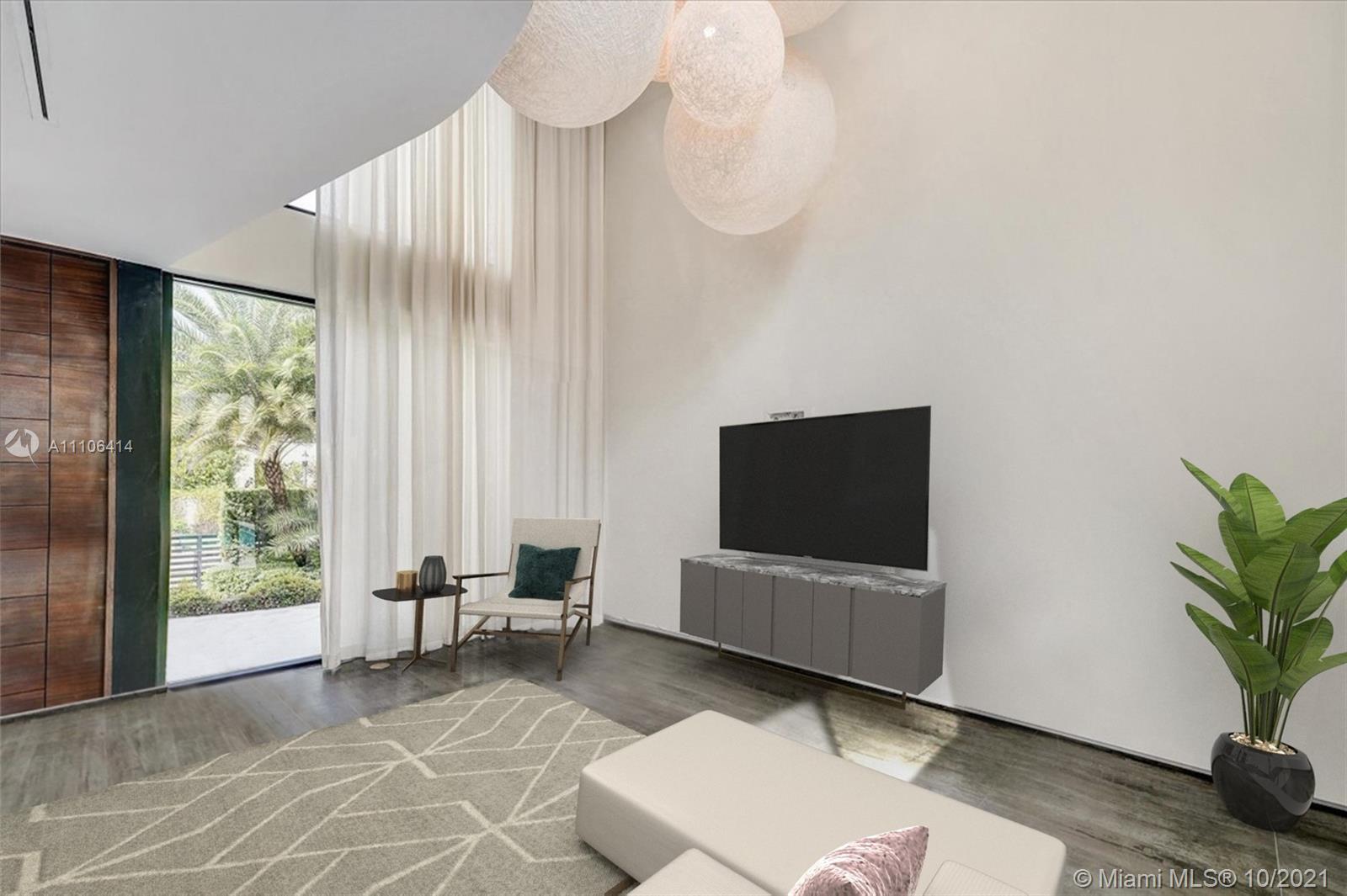2125 North Bay Road Miami Beach, FL 33140 - Photo 13 of 71 a living room with furniture and a flat screen tv