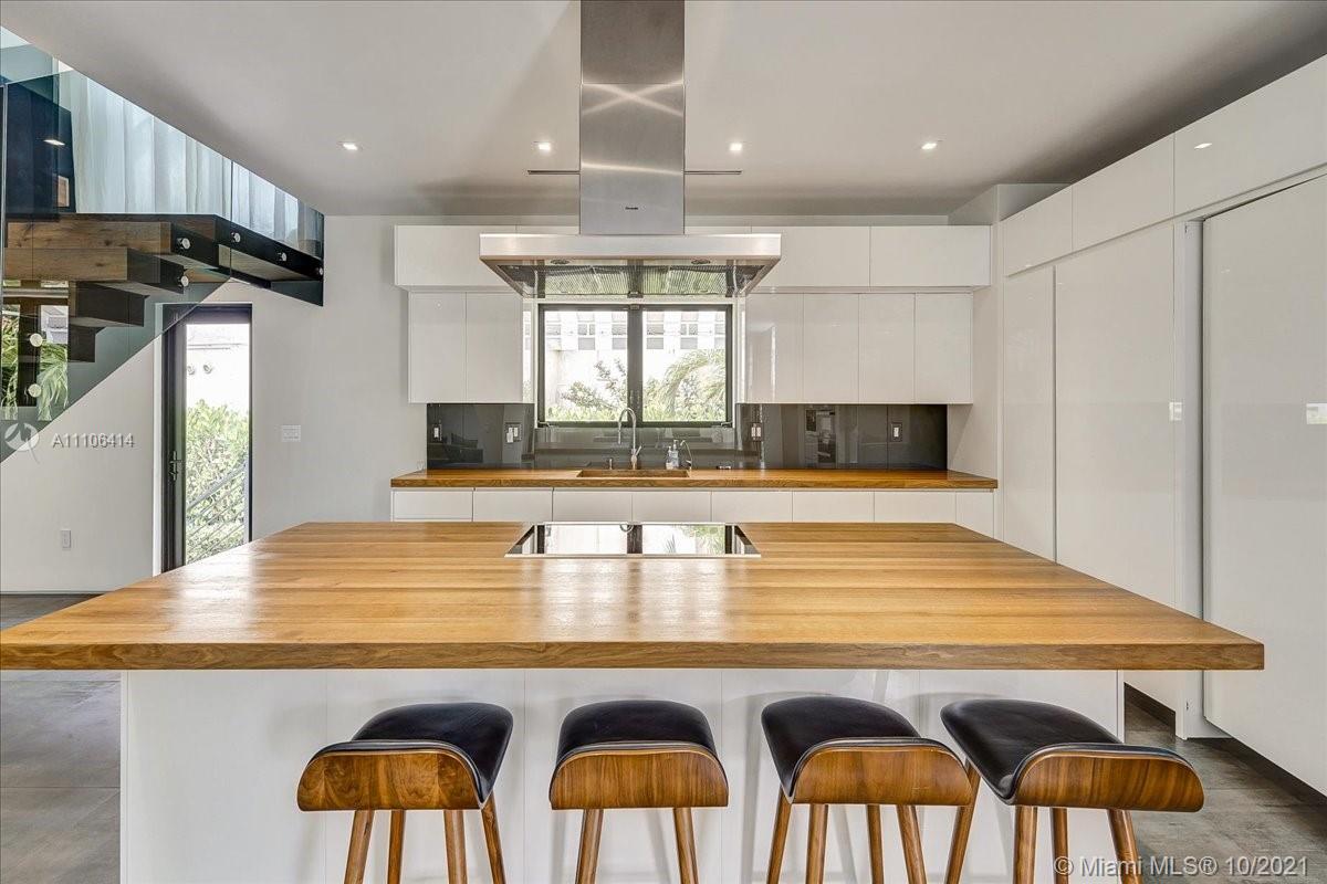 2125 North Bay Road Miami Beach, FL 33140 - Photo 17 of 71 a kitchen with cabinets and window