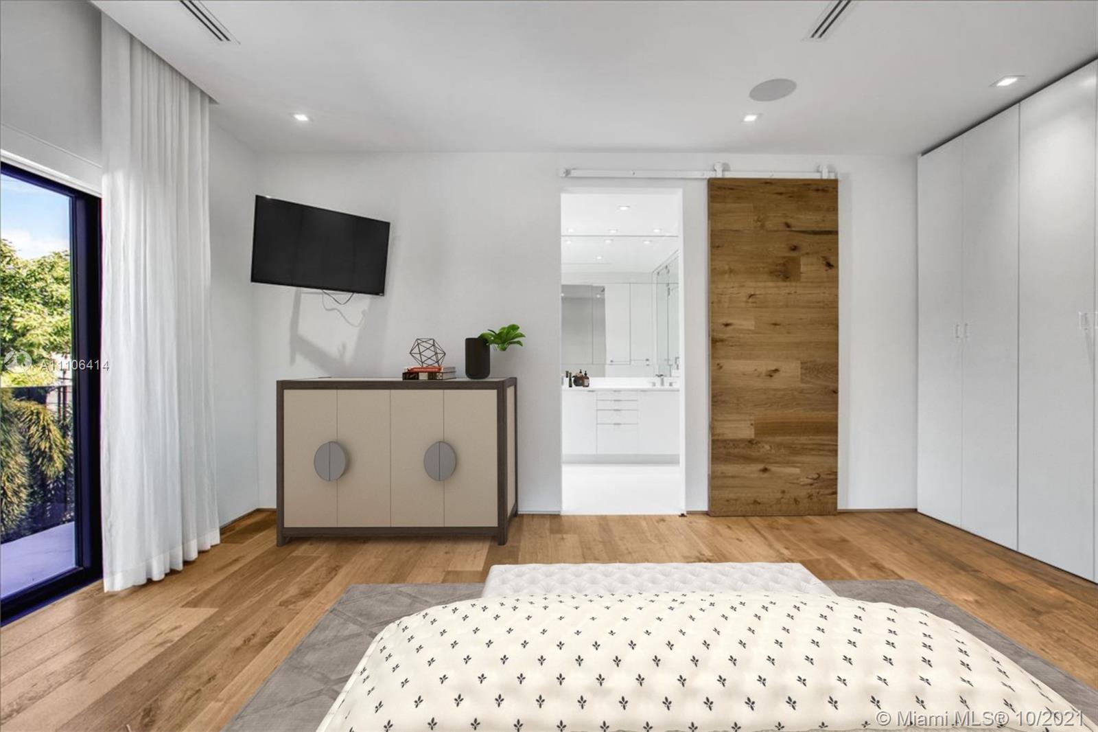 2125 North Bay Road Miami Beach, FL 33140 - Photo 26 of 71 a bedroom with a bed and a flat screen tv