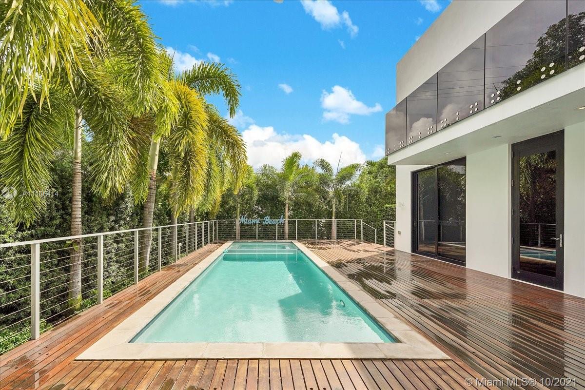 2125 North Bay Road Miami Beach, FL 33140 - Photo 3 of 71 a view of a swimming pool with a patio