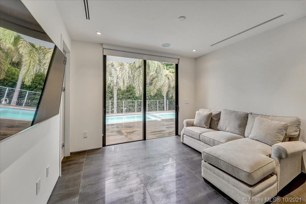 2125 North Bay Road Miami Beach, FL 33140 - Photo 31 of 71 a living room with furniture and a large window