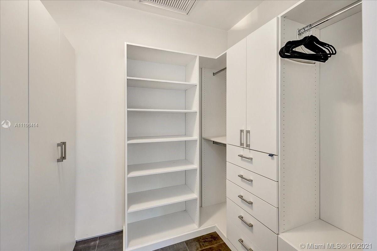 2125 North Bay Road Miami Beach, FL 33140 - Photo 33 of 71 a view of walk in closet with empty racks