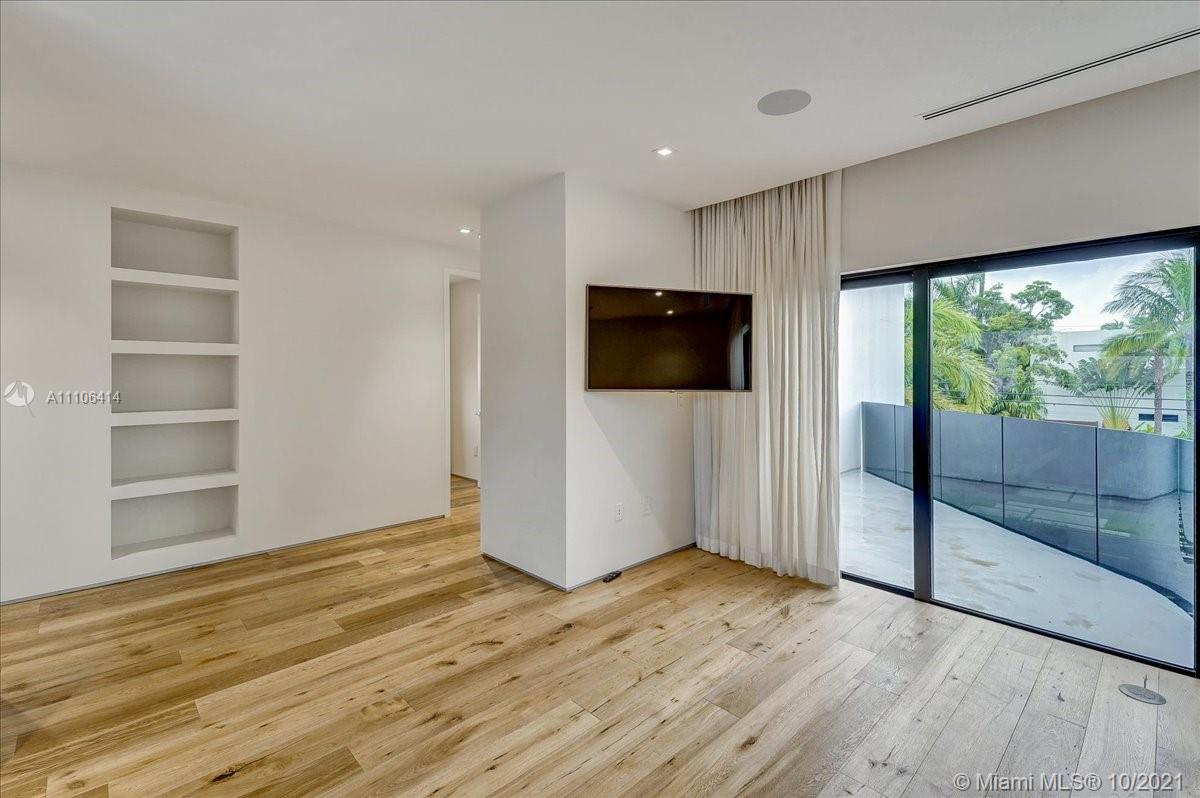 2125 North Bay Road Miami Beach, FL 33140 - Photo 42 of 71 a view of empty room with wooden floor and fan