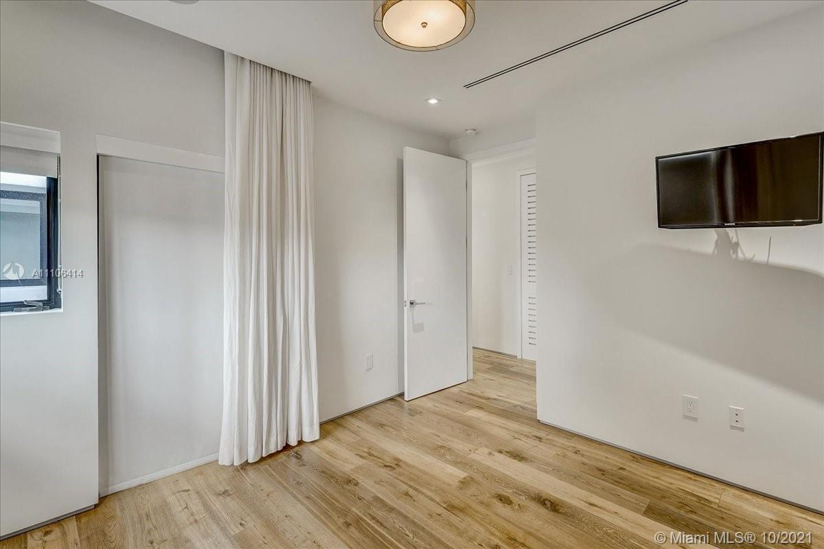 2125 North Bay Road Miami Beach, FL 33140 - Photo 47 of 71 a view of empty room with wooden floor