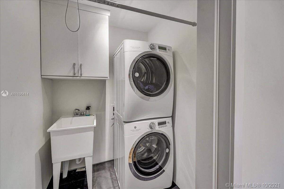 2125 North Bay Road Miami Beach, FL 33140 - Photo 58 of 71 a utility room with dryer and washer