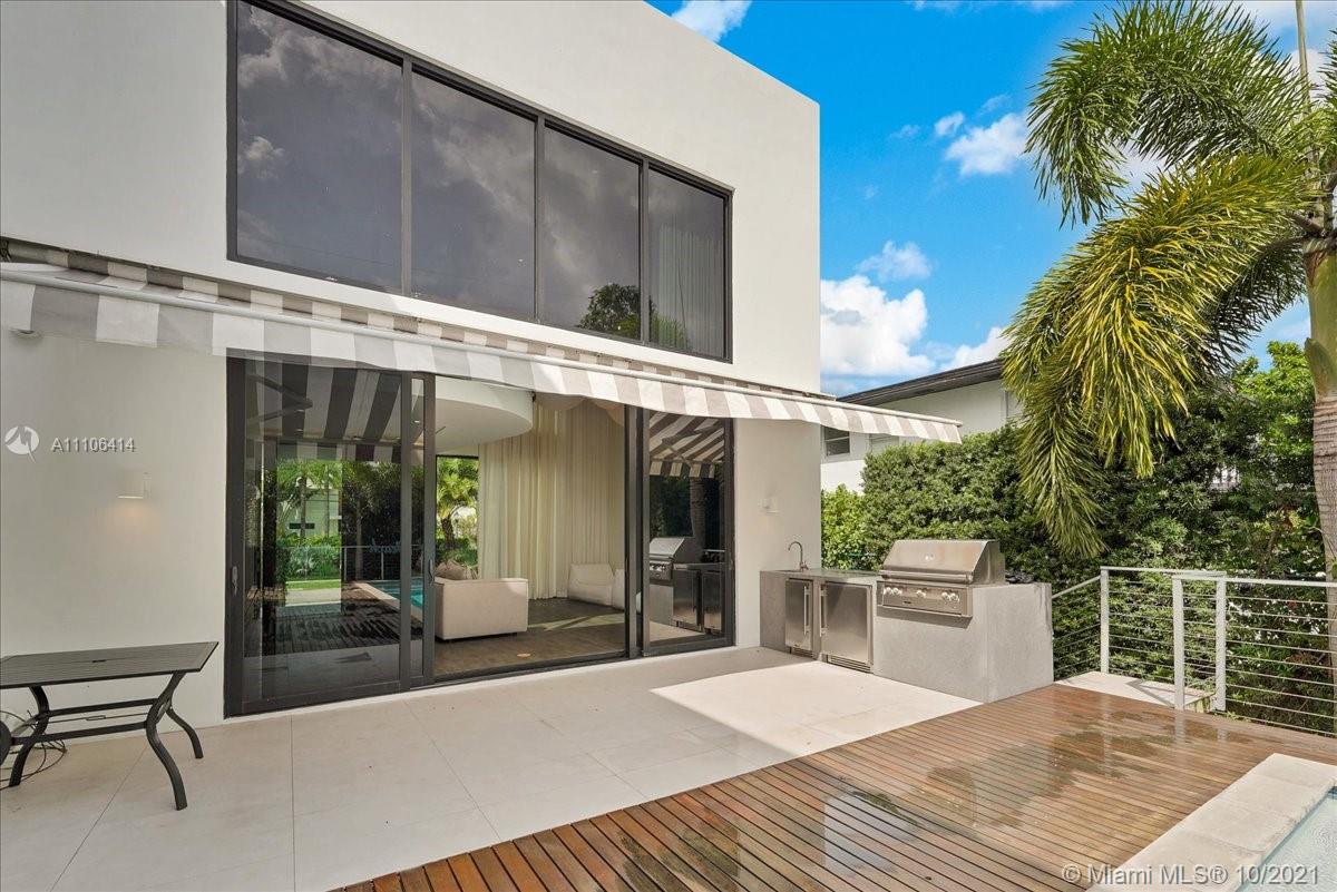 2125 North Bay Road Miami Beach, FL 33140 - Photo 66 of 71 a view of a chair and tables in the balcony