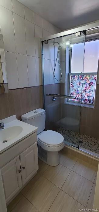 141-12 78th Road, Unit 1G Queens, NY 11367 - Photo 7 of 9 a bathroom with a toilet sink and vanity