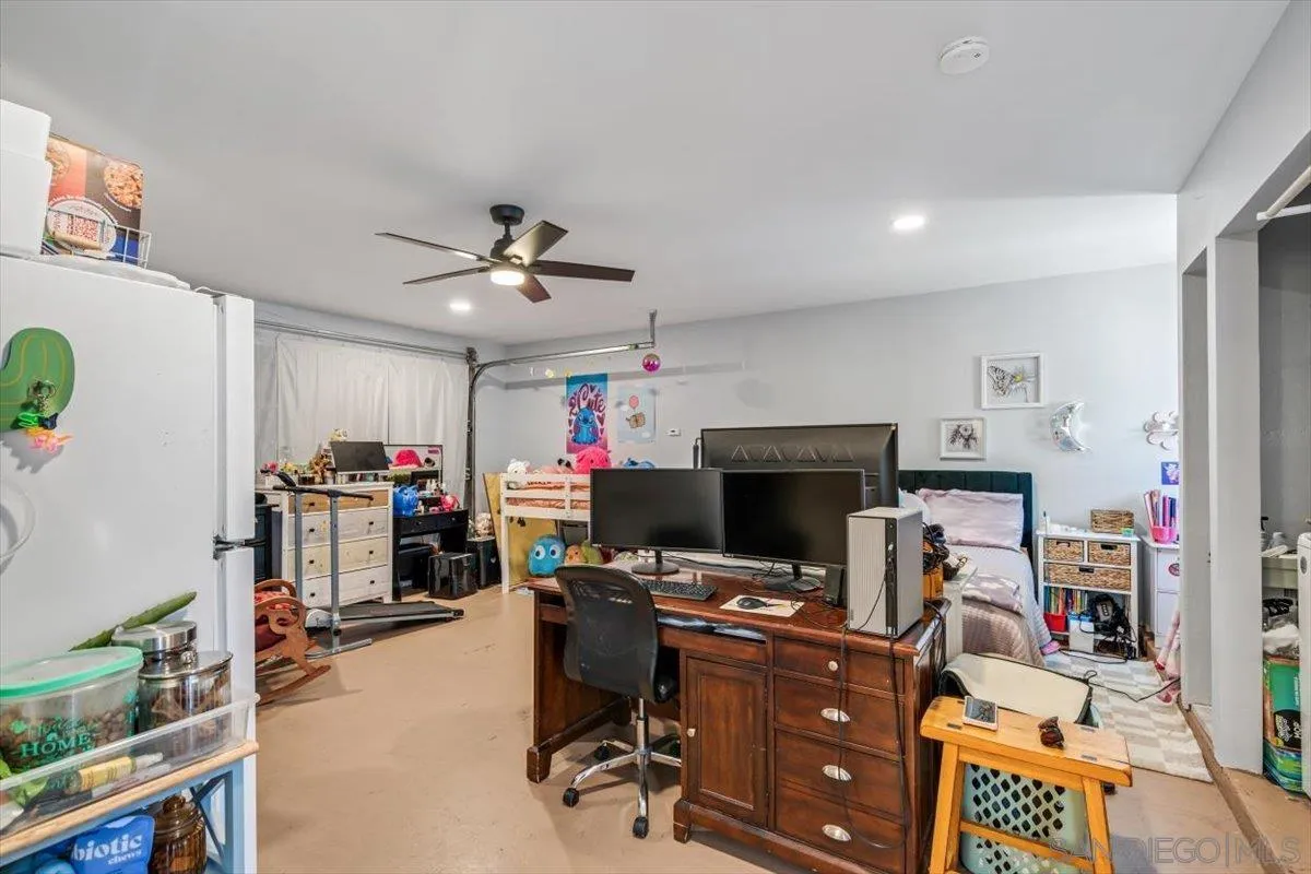2019 Bridgeport Chula Vista, CA 91913 - Photo 19 of 32 a view of a workspace with furniture and a garage
